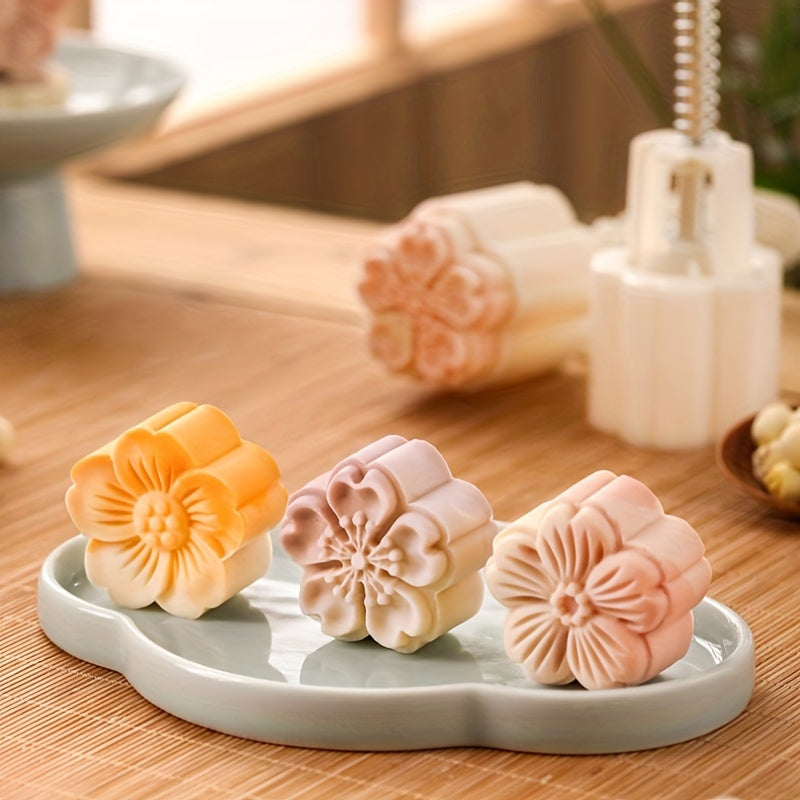 Set of 4 plastic mooncake embossing molds with blossom design for baking and crafting desserts.