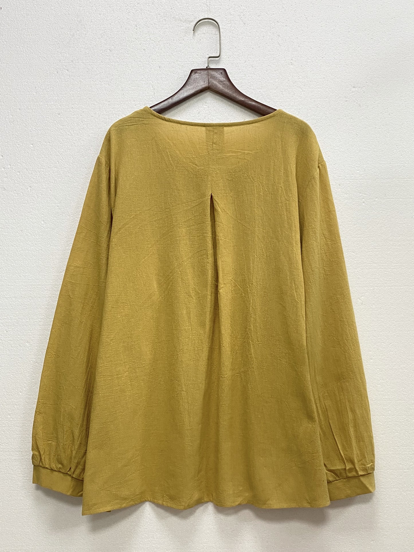 Solid pintuck crew neck blouse for plus-size women, perfect for spring and fall.