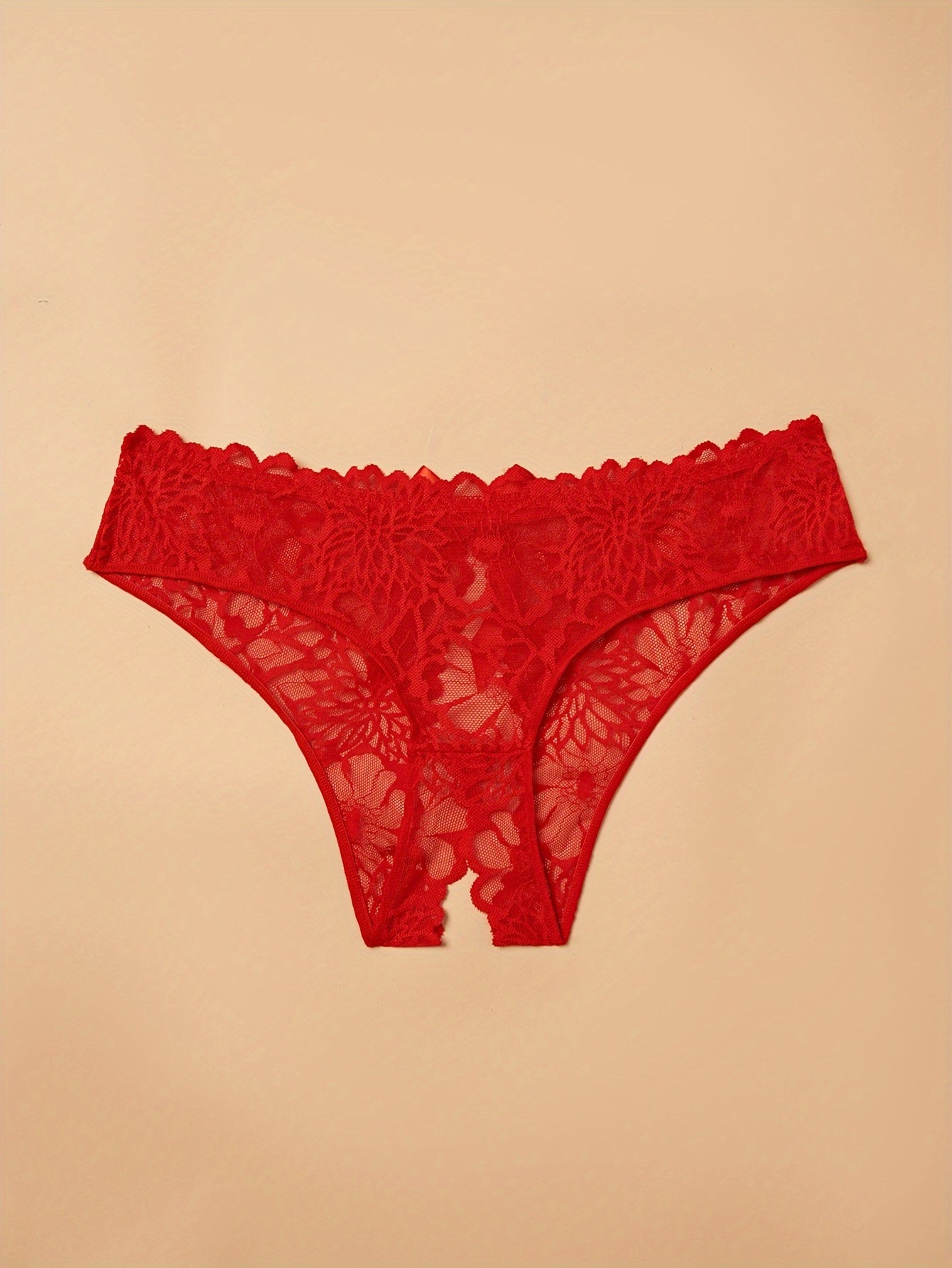 Plus size lace thong panties for women with back bow detail, made of nylon for a comfortable fit.