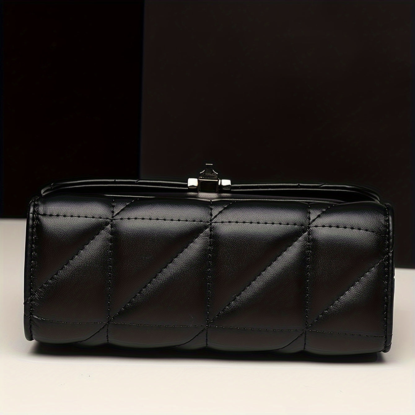 Stylish black quilted crossbody bag with adjustable strap, waterproof faux leather and embroidered detail. Perfect for women's fashion with a classic look and matching chain.