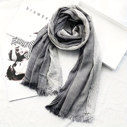 Elegance meets simplicity with our Classic Striped Tassel Scarf, the perfect fashion accessory.