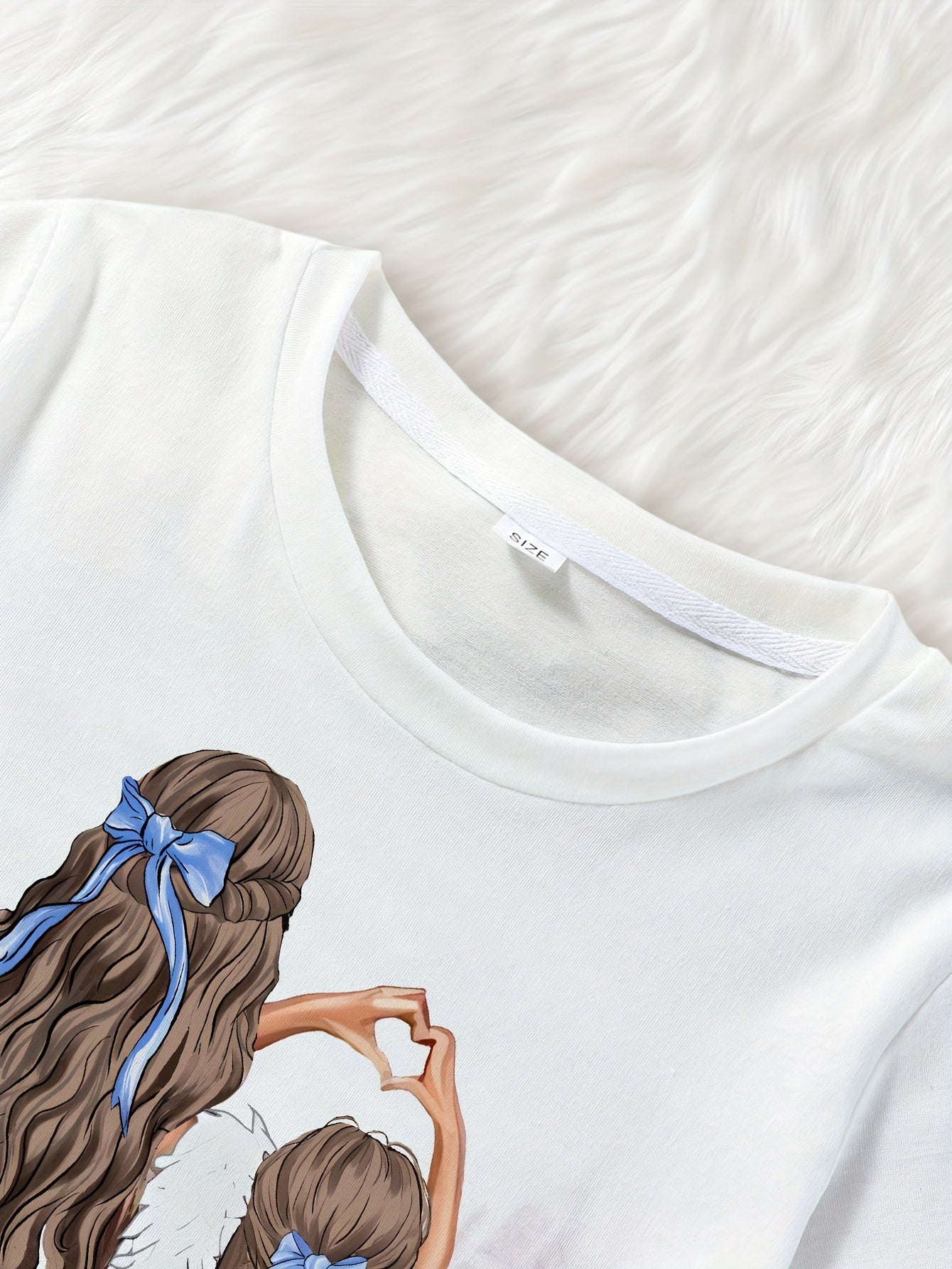 Girls' summer cartoon tee with crew neck, short sleeves, and regular fit. Made from polyester fabric.