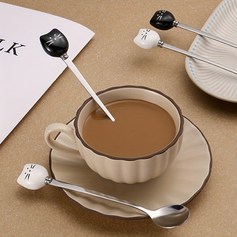 Charming stainless steel coffee stirrers with whimsical ceramic kitty spoons.