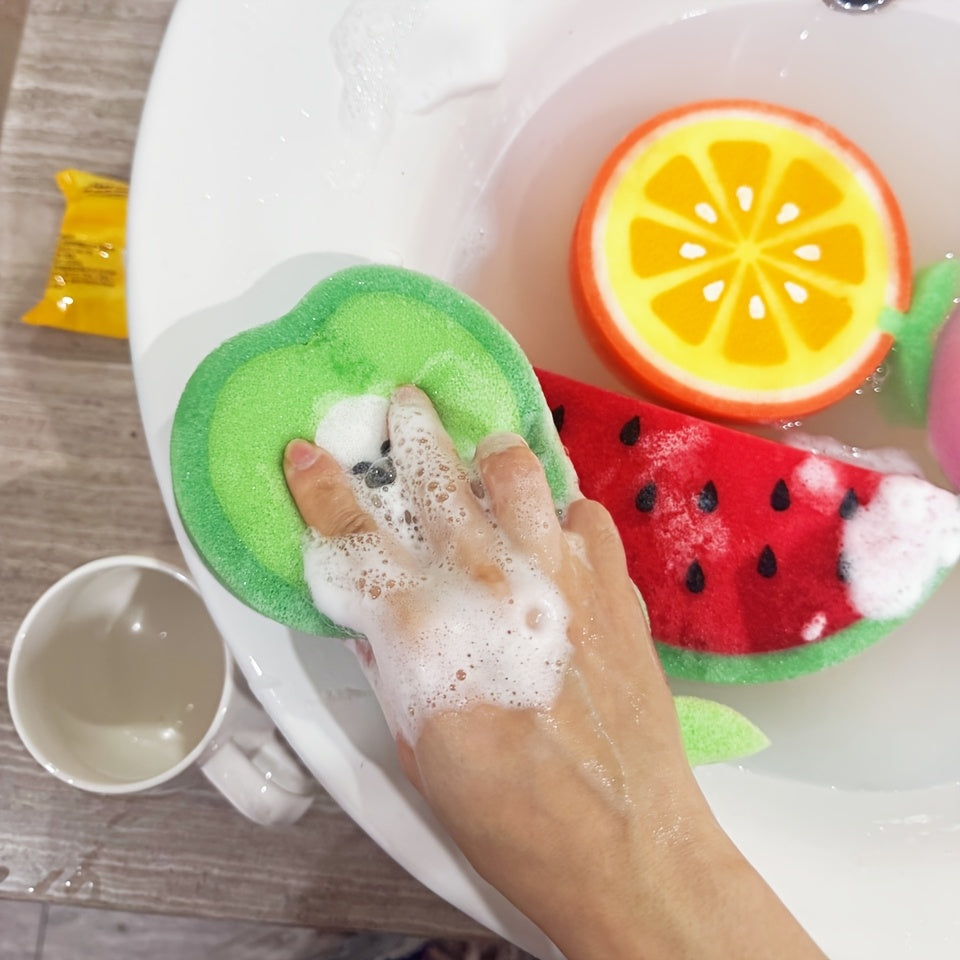 Set of 4 fruit-shaped cleaning sponges made of polyurethane. These multi-purpose scouring pads are perfect for use in the kitchen, bathroom, dishes, car wash, and supermarket. The set includes sponge shapes resembling a pear, orange, dragon fruit, and