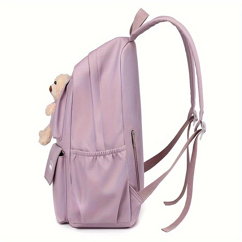 Purple women's casual nylon backpack with laptop compartment, adjustable strap and tassel detail. Features polyester lining, zipper closure, and fashionable shoulder bag design for going