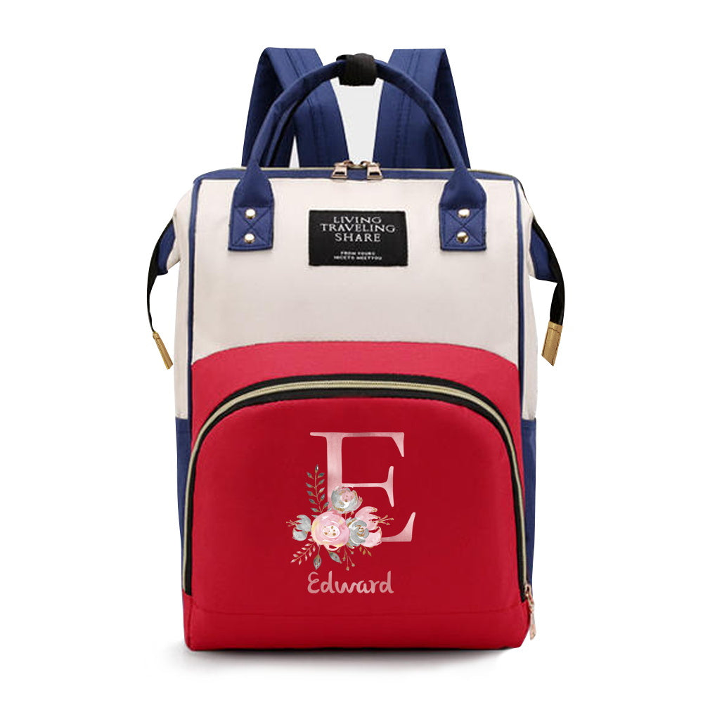 Personalized Mommy Backpack made of durable Oxford cloth with ample storage space for diapers and other essentials. Features customizable initials and name, as well as convenient bottle pockets. Perfect for nursing mothers on-the-go, with options for A-Z