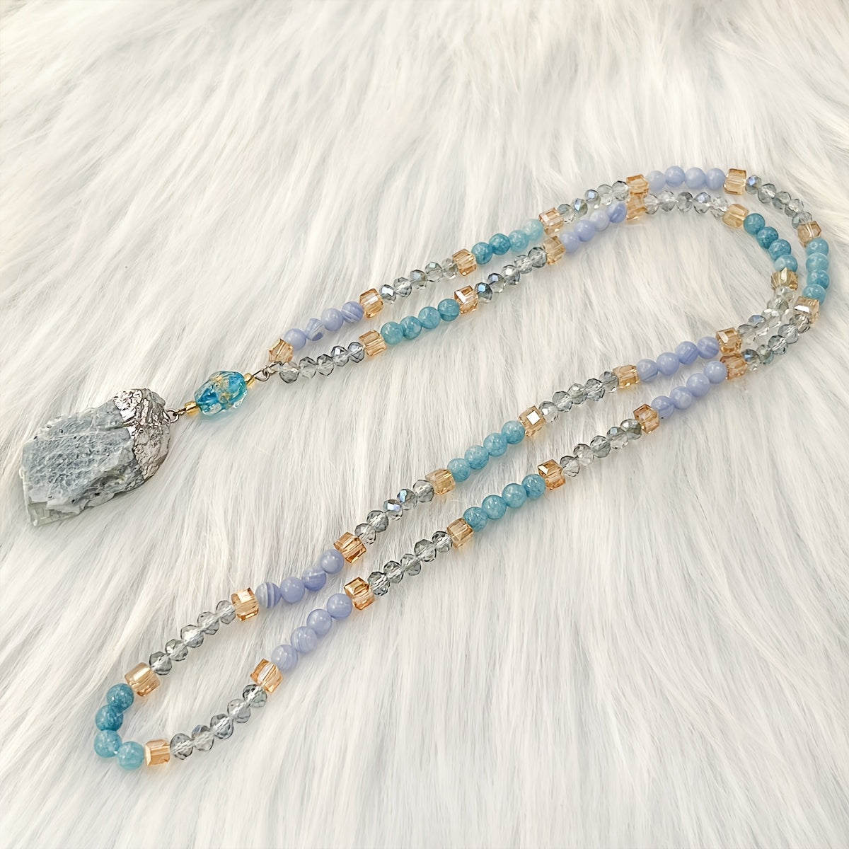 Unique vintage-inspired mala necklace featuring a raw kyanite pendant, beautiful blue lace agate and amazonite beads. Hand-beaded with love, this crystal japamala promotes chakra mindfulness and inner peace. This elegant boho accessory is perfect for any