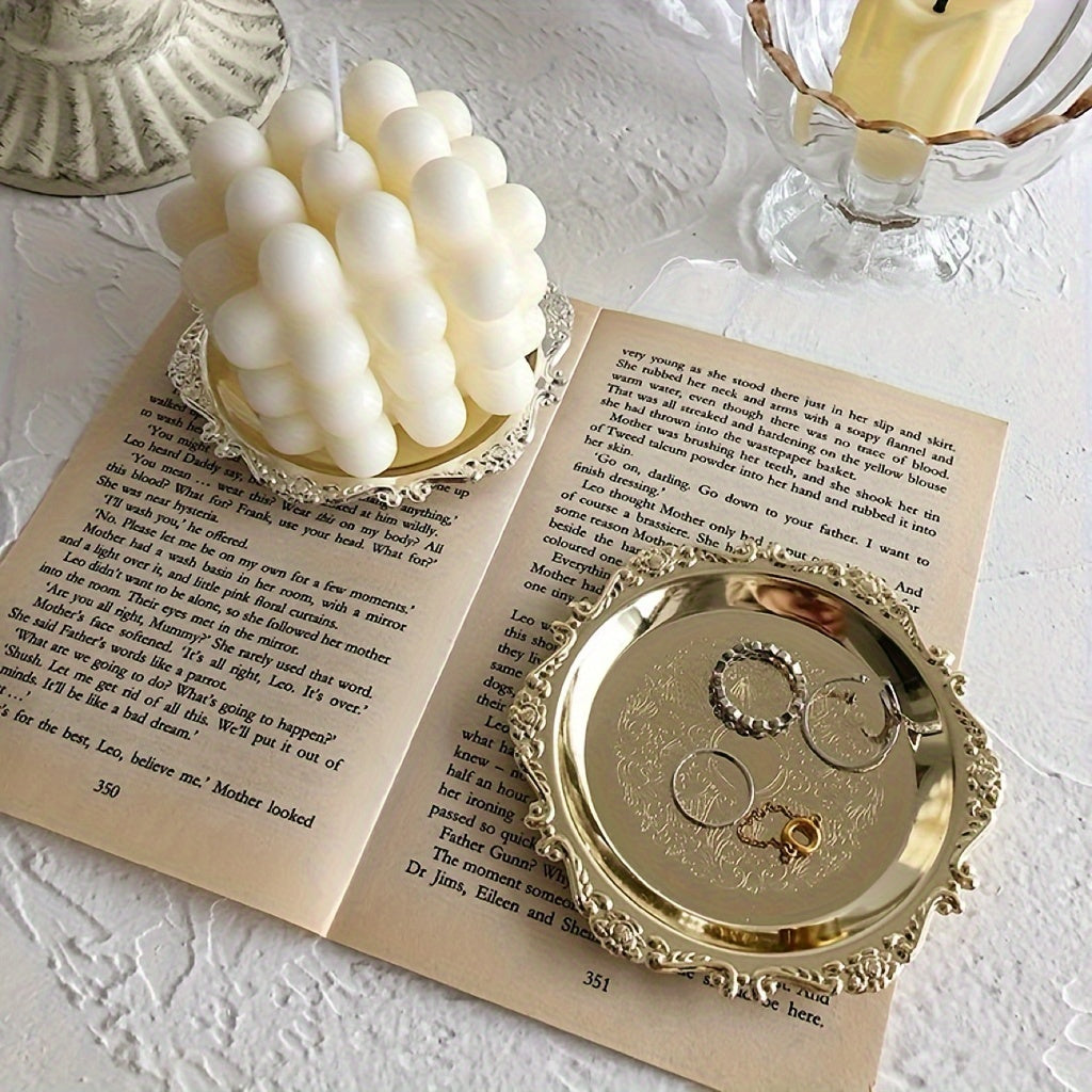 This Retro Carved Metal Small Tray doubles as an Aromatherapy Candle Holder and Jewelry Ornament in a Palace Style Coffee Shop, perfect for using as a Photo Prop or displaying delicate jewelry.