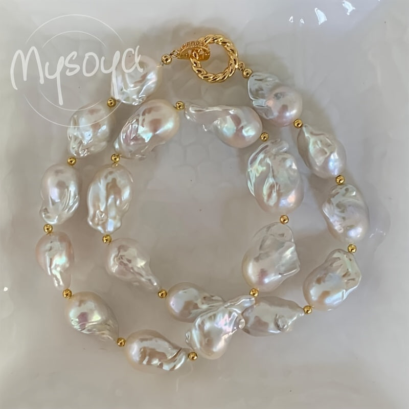 This elegant and unique baroque freshwater pearl necklace from MYSOYA Brand is the perfect accessory for any occasion. With pearls ranging from 14-23mm in size, this handmade boho necklace is a stunning choice for a party, wedding, anniversary, or as a