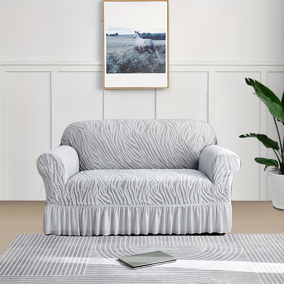 Wave pattern sofa slipcover with skirt, non-slip and dustproof. Protects furniture from cat scratches. Machine washable for easy cleaning. Suitable for bedroom, office, or living room décor.