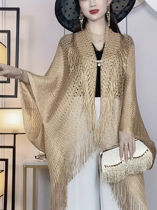 Stylish plus-size cardigan with tassel details, hollow-out design, and sun protection shawl. Made of polyester - hand or dry clean only.