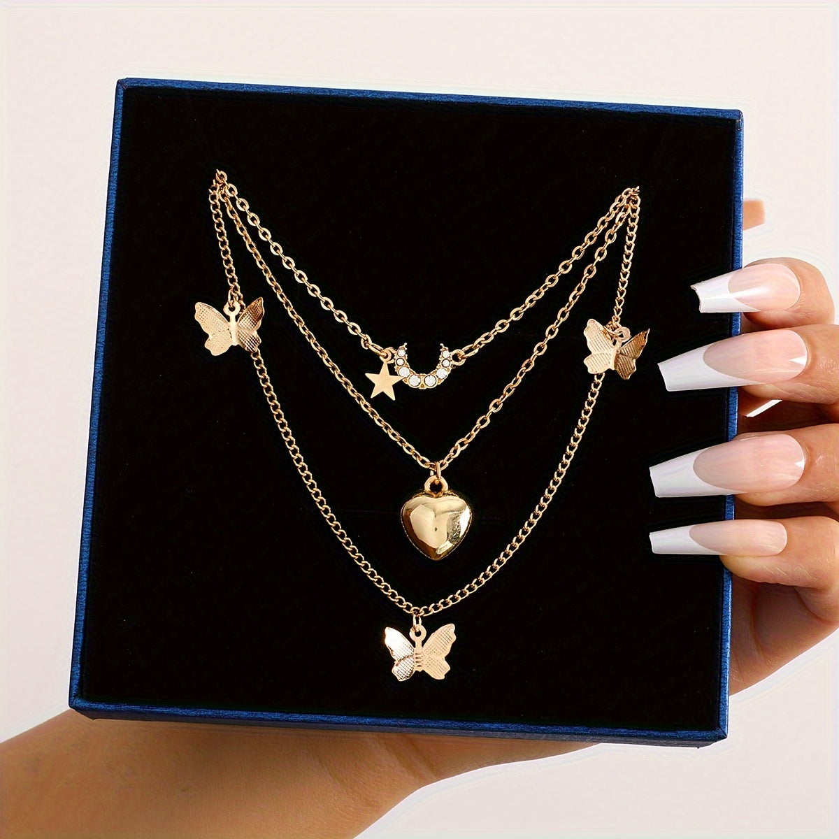 Set of 11 pieces featuring faux pearl and rhinestone star, butterfly, and heart necklaces for women. This fashion stacking jewelry set is perfect for daily wear, dates, holidays, and parties. Ideal for adding a simple and vacation style to any outfit.