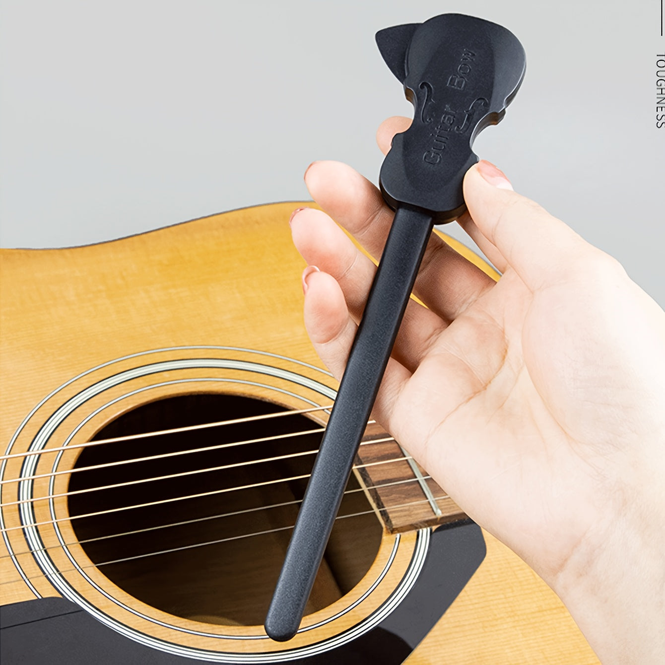 Black PP guitar bow for playing classical music on folk guitar, organ, and other musical instruments. Portable and creative picking tool.