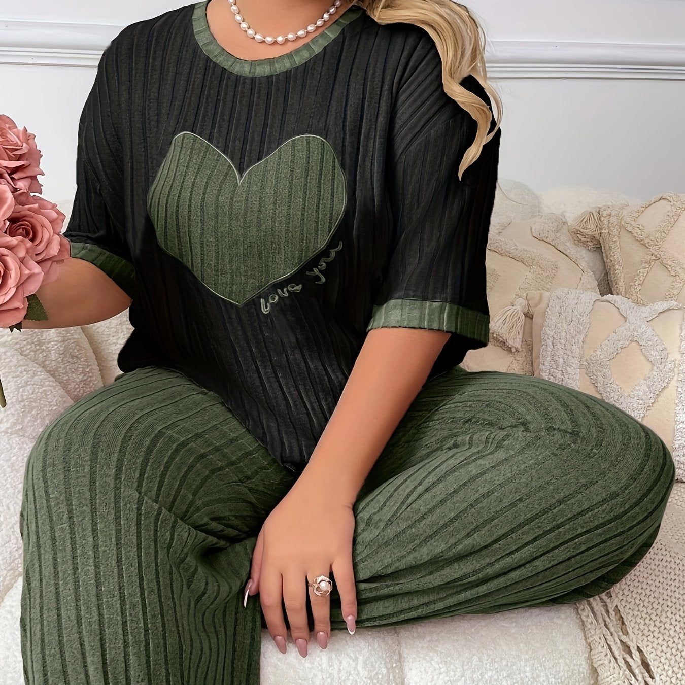 Cozy heart embroidered pajama set in plus size, includes short sleeve top and long pants made of soft polyester. Machine washable.