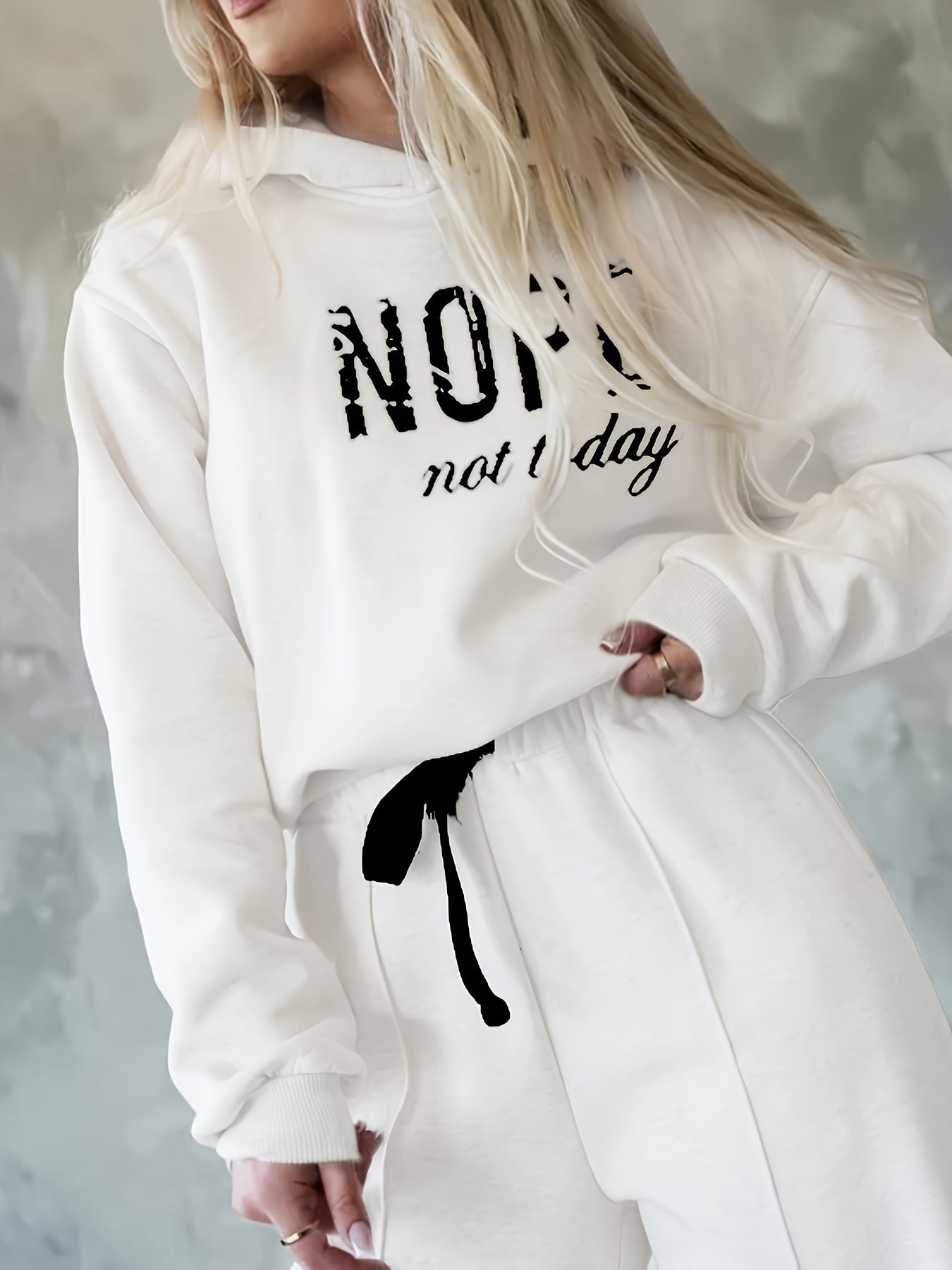 Women's casual sports outfit with a warm hooded sweatshirt and letter patterns.