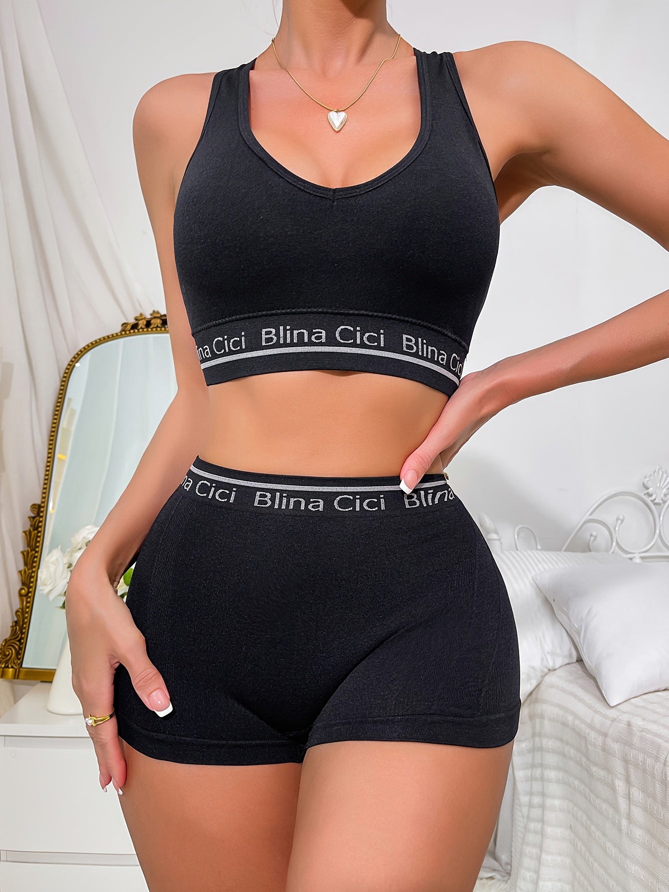 Women's lingerie set includes letter print bra and panties, racerback sports bra, and elastic panties.