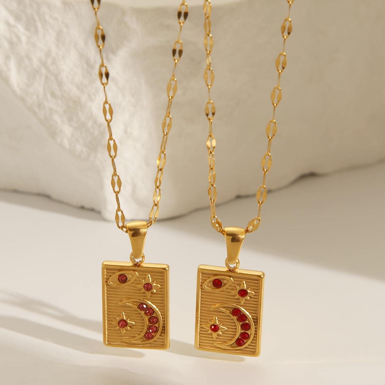 18K Golden Plated Stainless Steel Pendant Necklace featuring a Minimalistic Geometric Rectangle & Crescent Moon Design adorned with Red Synthetic Zirconia Stones, a Stylish and Versatile Piece of Fashion Jewelry perfect for Women to Wear on Both Daily