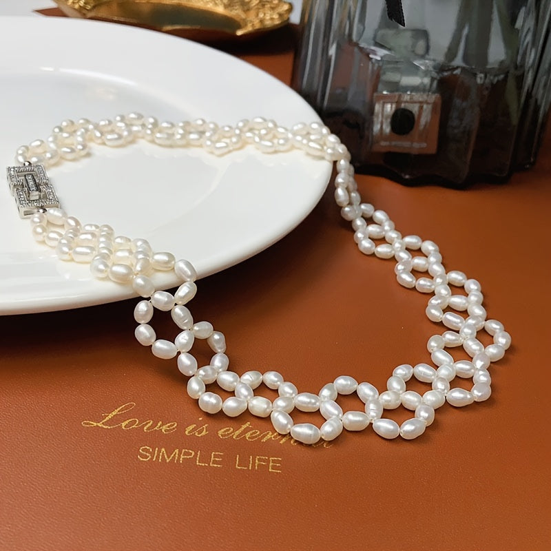 Elevate your style at parties, holidays, and special occasions with this exquisite, handcrafted clavicle chain inspired by delicate French vintage designs. This luxurious freshwater pearl necklace is sure to add a touch of elegance to any outfit.