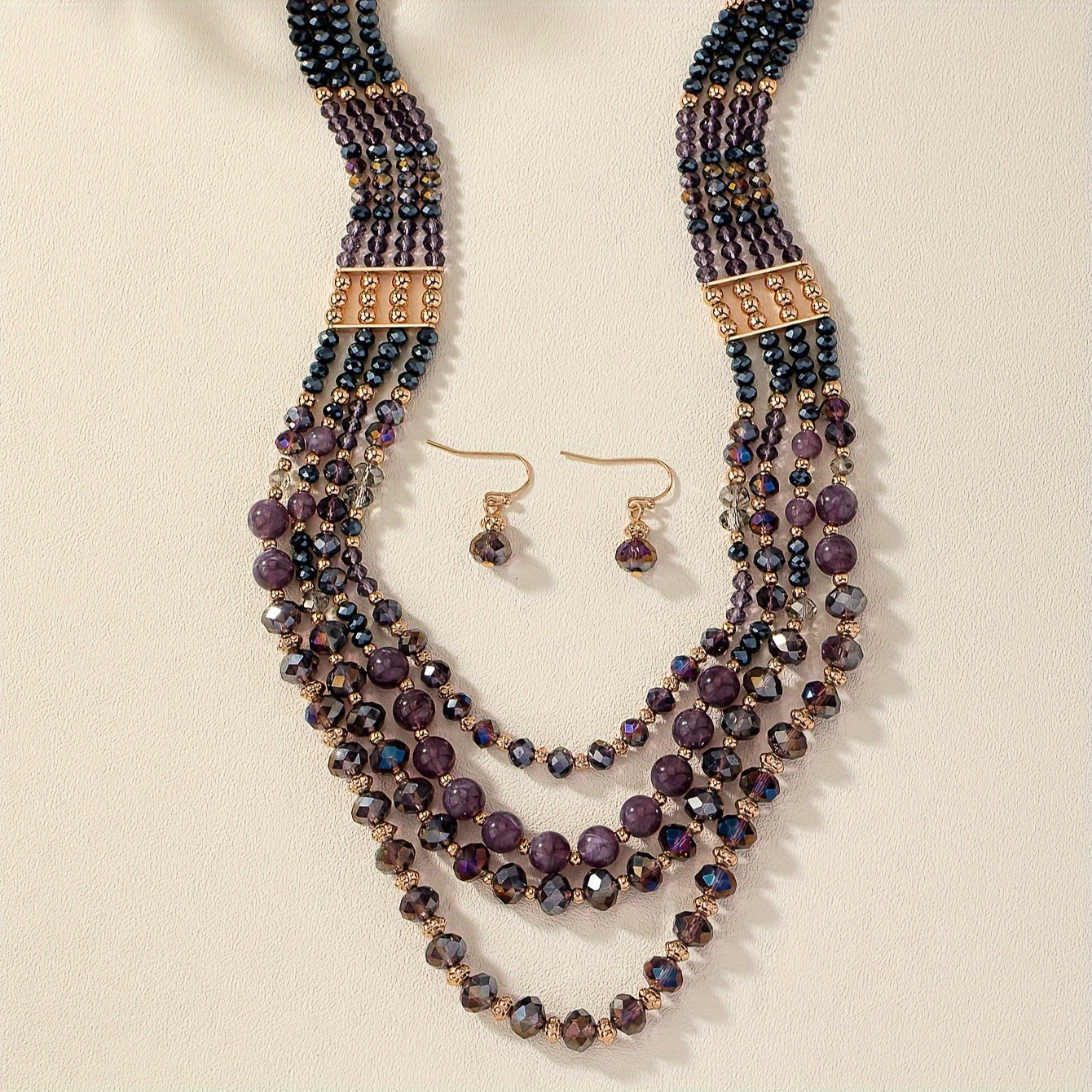 Luxurious and elegant, this Purple Series Beaded Necklace Set exudes style and sophistication. Featuring multiple layers, it is perfect for stacking and adds a touch of glamour to any woman's jewelry collection.