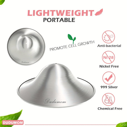 A set of two regular size silver nursing cups, designed as nipple shields for nursing mothers.