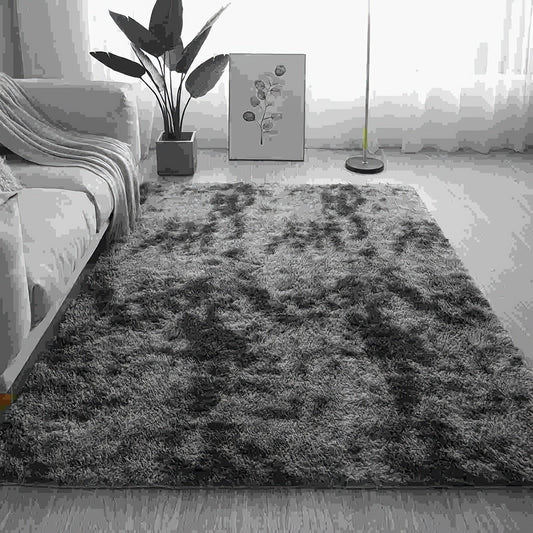 One piece of plush, fluffy area rug designed for bedrooms. This soft, fuzzy shaggy rug is black in color and rectangular in shape, perfect for adding warmth to your living room. It features a non-slip bottom to ensure safety. Great for Halloween or