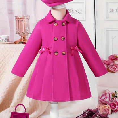 Youthful girls can look stylish in this casual polyester trench coat with lapel collar, double-breasted design, and matching bow detail and hat.