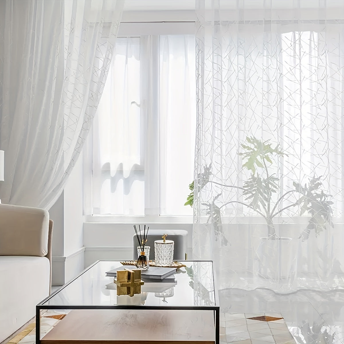 Create a modern and sophisticated look in your living room or bedroom with this 1-piece simple line embroidery sheer curtain. Featuring a sleek geometric design in white, this translucent curtain filters light beautifully while adding a stylish touch to