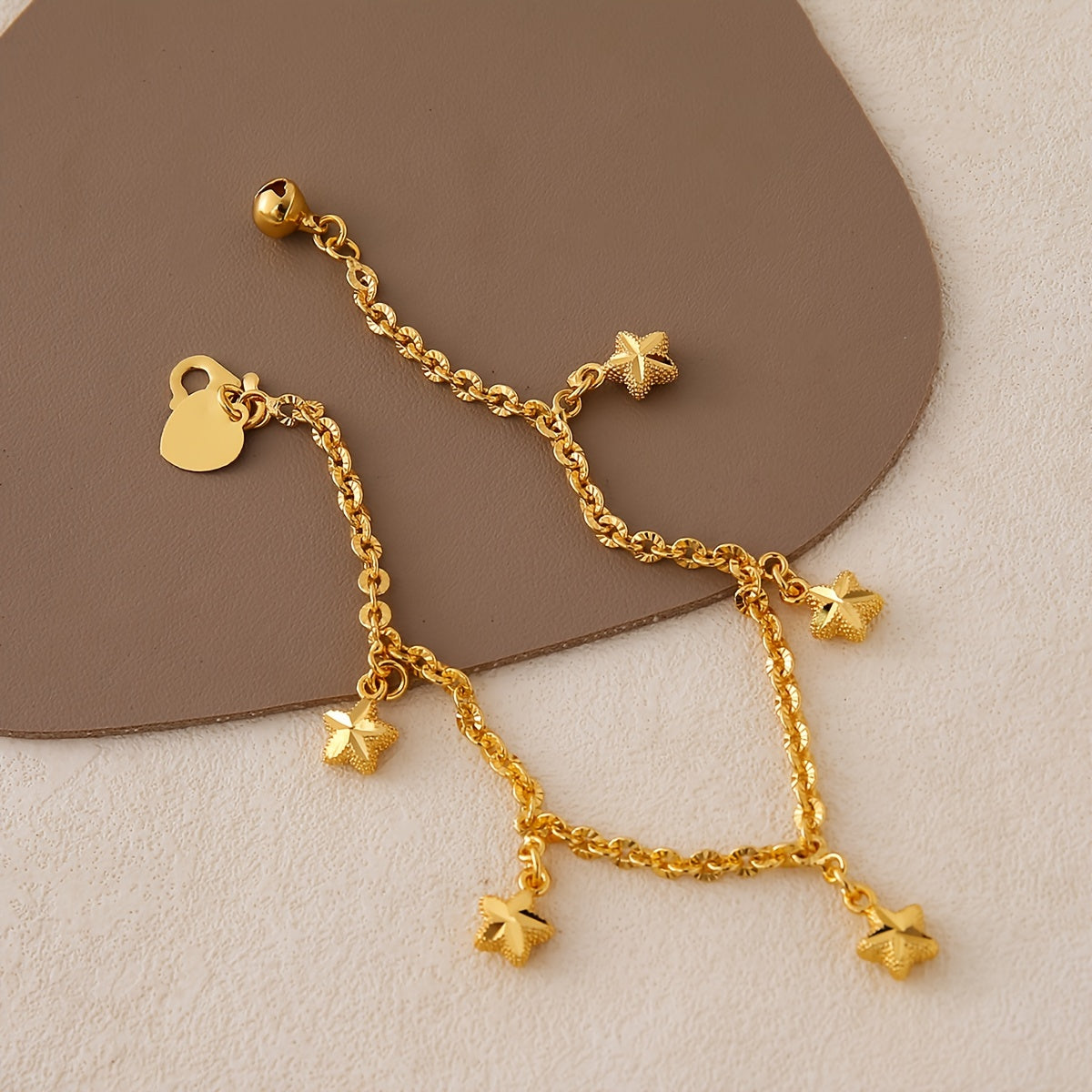 A charming bracelet featuring a simple star charm, plated in 24K gold. Made from copper material, this bracelet has an adjustable chain link wristband perfect for women. Ideal for daily wear, sports, and Mardi Gras Day, this accessory is suitable for all