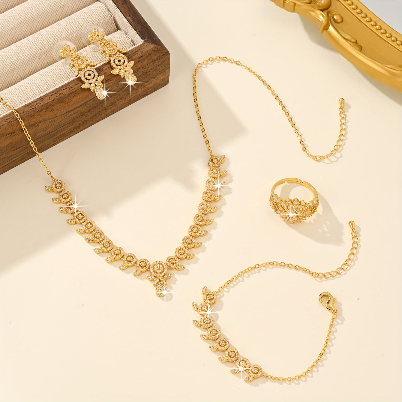 Luxurious Floral Jewelry Set featuring 5 pieces, made with 18K Gold Plated Copper, adorned with Synthetic Zirconia stones in a Leaf and Teardrop design. This set includes a Necklace, Bracelet, Earrings, and an Adjustable Ring, perfect for Women to wear