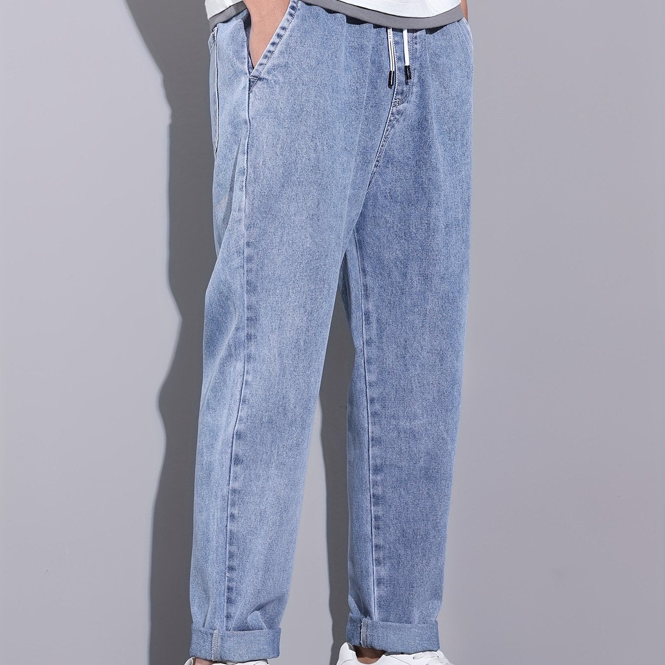 Men's light blue drawstring waist straight-leg jeans in glossy fabric, perfect for all seasons.