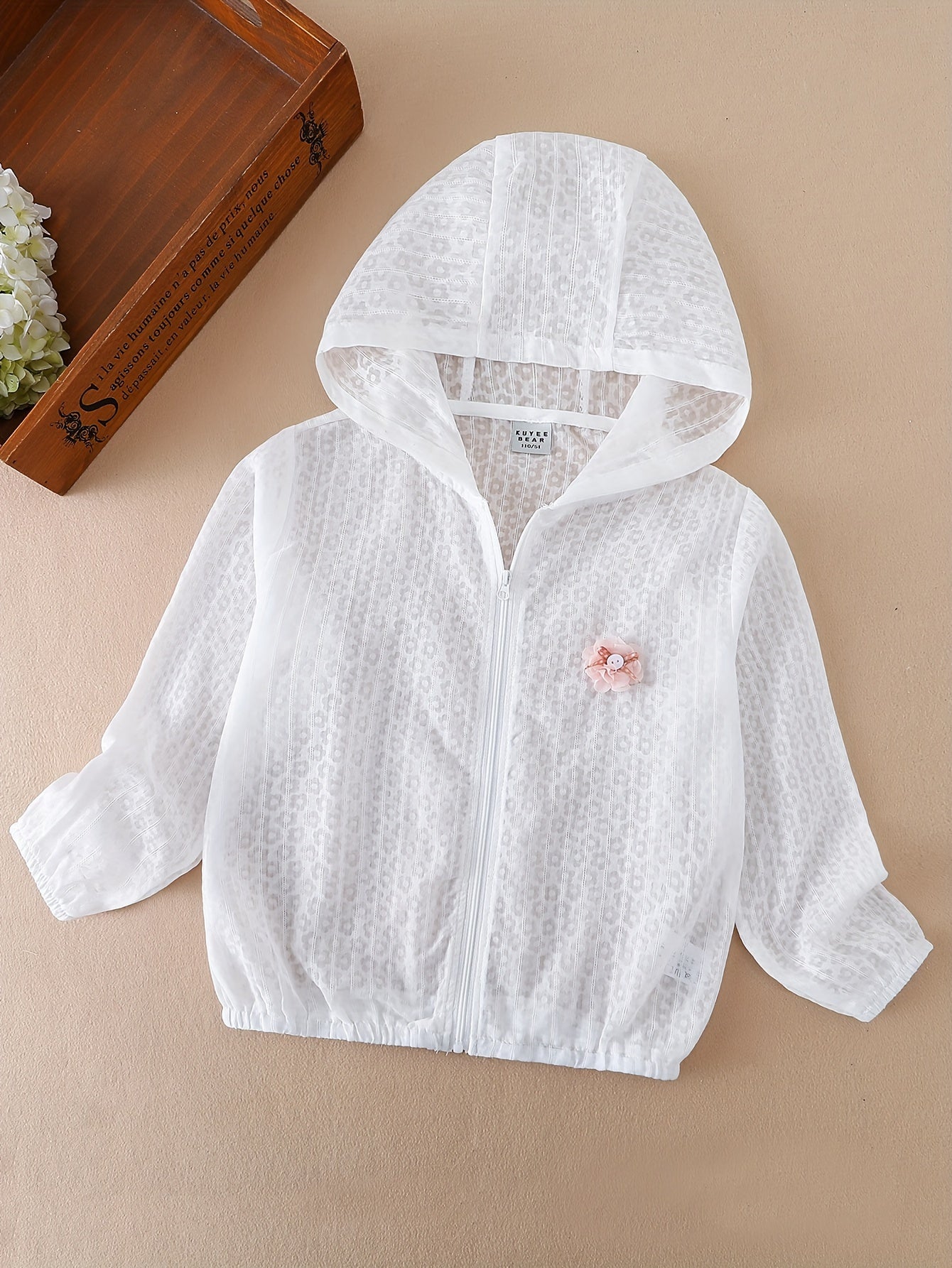 Lightweight zip-up sunscreen jacket for girls with flower decor, perfect for summer.