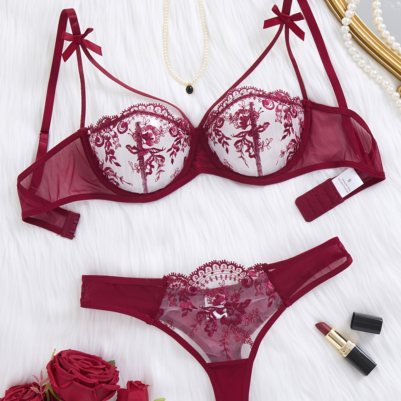 Floral embroidered two-piece bra set with semi-transparent fabric.