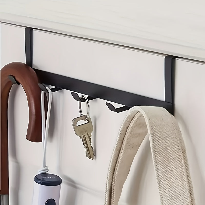 Contemporary 5-hook metal rack, 29cm long, rust-resistant with polished finish. Easy to install and suitable for hanging towels and clothes. Practical and affordable.