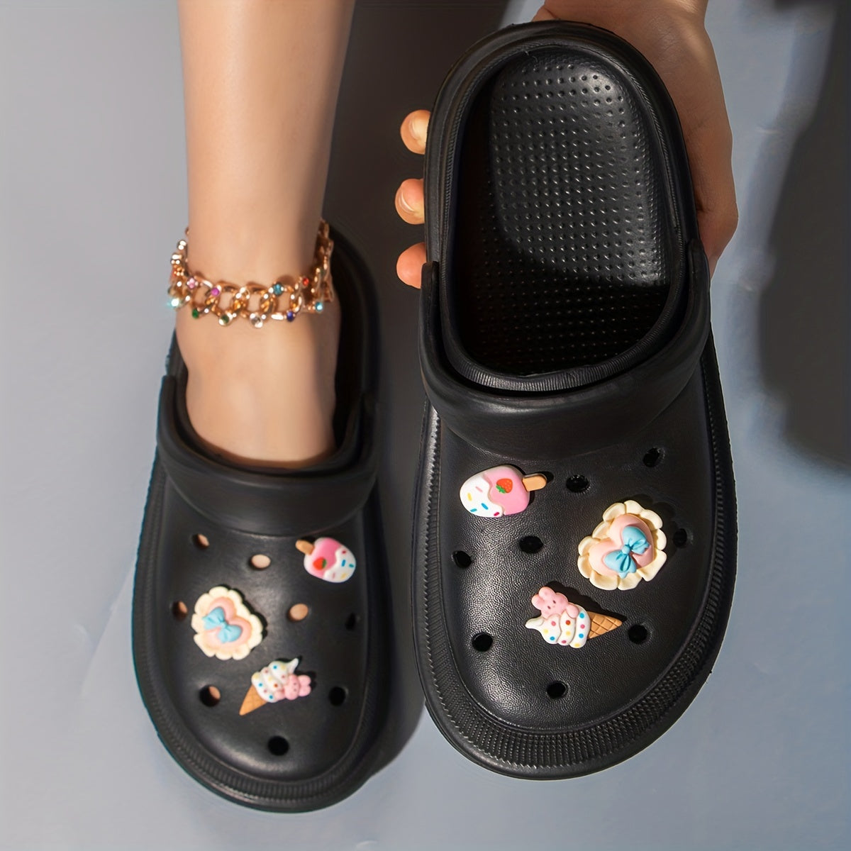 Women's cute cartoon clogs with round toe and breathable design for comfortable wear.