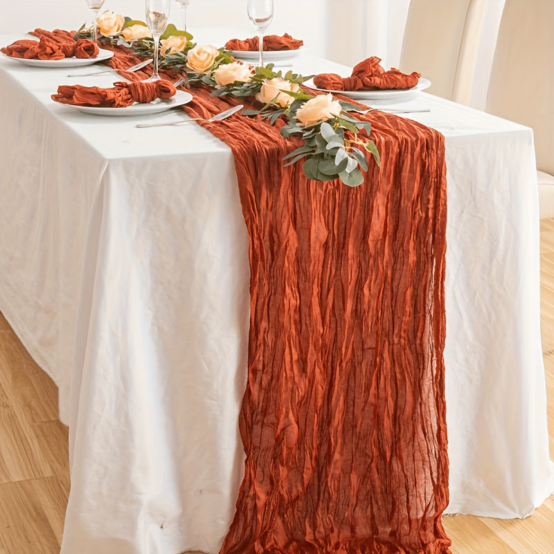 Boho table runner made of pleated polyester gauze, perfect for rustic or wedding decor. Ideal for holiday parties or showers.