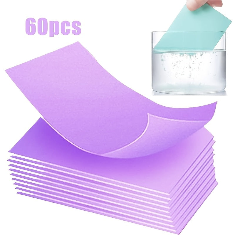 Pack of 60 cleaning tablets made from paper material. Each tablet is individually wrapped for easy dispensing and is suitable for use on kitchen sinks, cookware, and washbasin stain removal. Available in purple and blue colors.