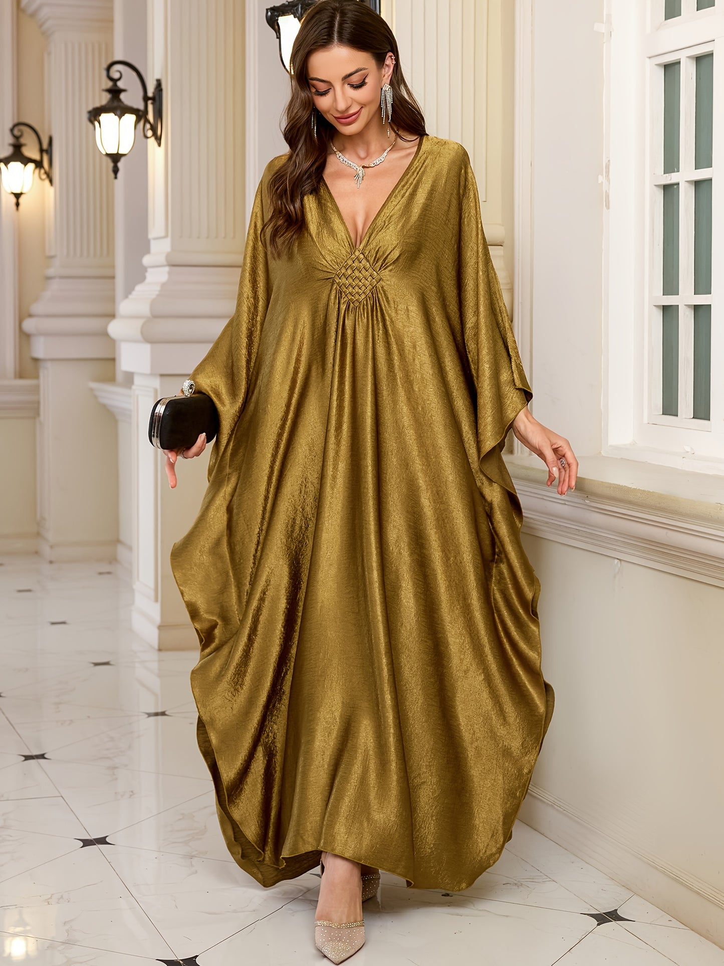 Stylish olive green V-neck kaftan dress with bat sleeves. Ideal as a beach cover-up or casual outerwear for women. Offers sun protection and a loose fit, perfect for spring/summer/fall