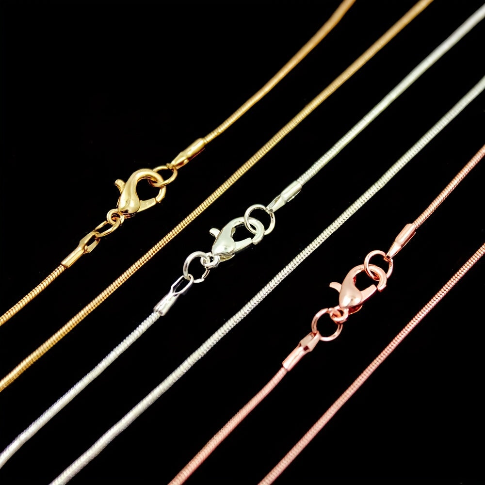 10 pieces of snake chains in Rose Gold, Gold, and Rhodium plating, ranging from 16 to 30 inches in length. Each chain comes with a lobster clasp and is perfect for creating custom jewelry pieces. Great for DIY crafting and jewelry making supplies.