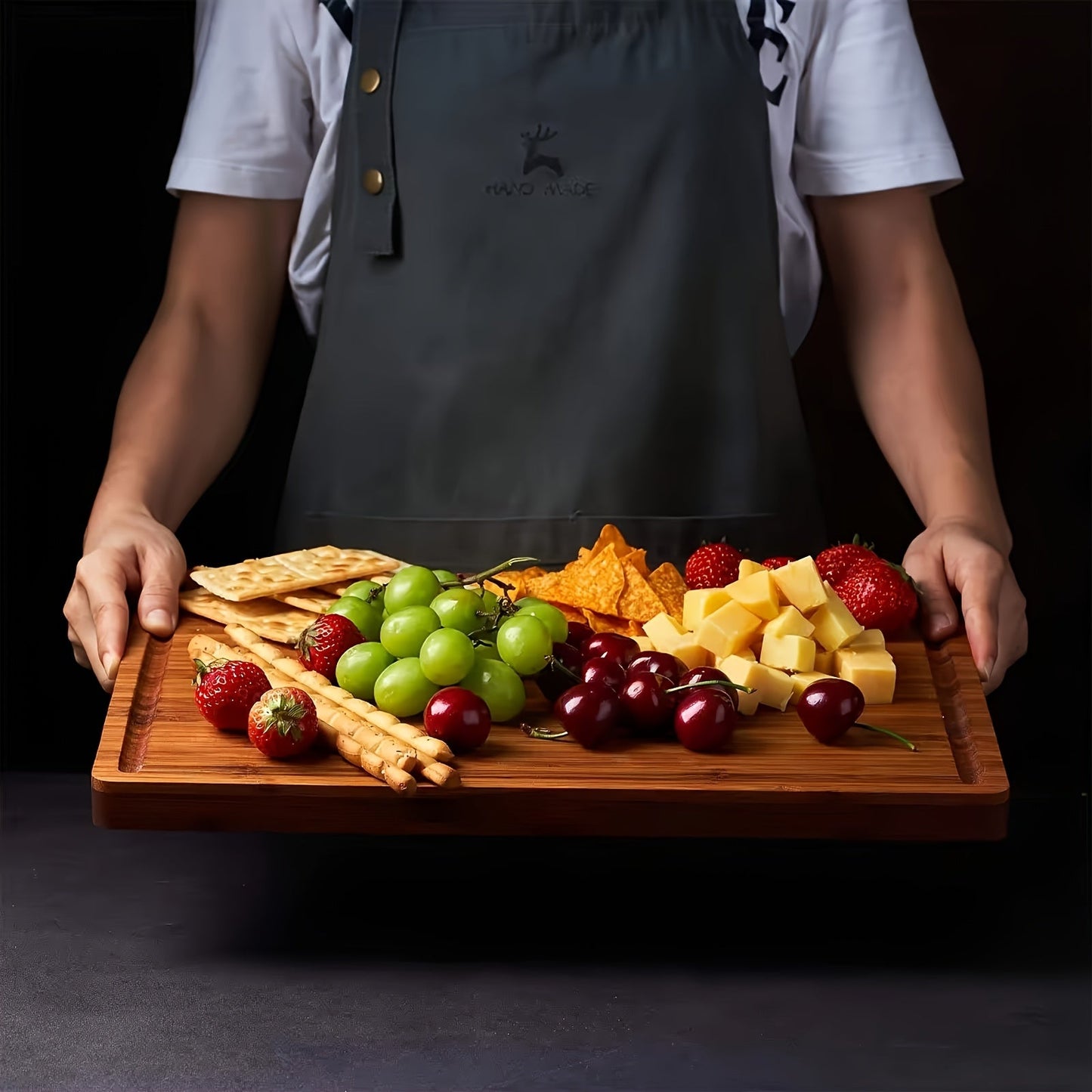 Large, thick bamboo cutting board with a juice groove, perfect for use as a butcher block. This food-safe charcuterie and cheese serving tray is ideal for your kitchen.