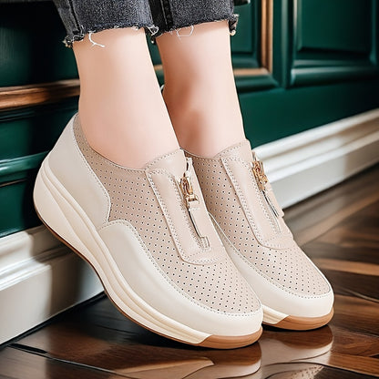 Beige perforated women's casual sneakers with zipper detail, thick sole, and anti-slip features.