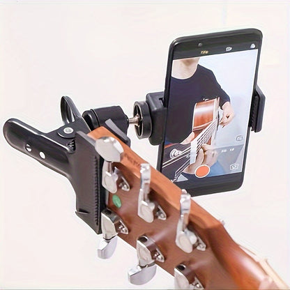 Adjustable ABS guitar headphone holder with 360-degree rotation doubles as a mobile phone stand for live streaming and music recording. Also functions as a desktop support bracket.