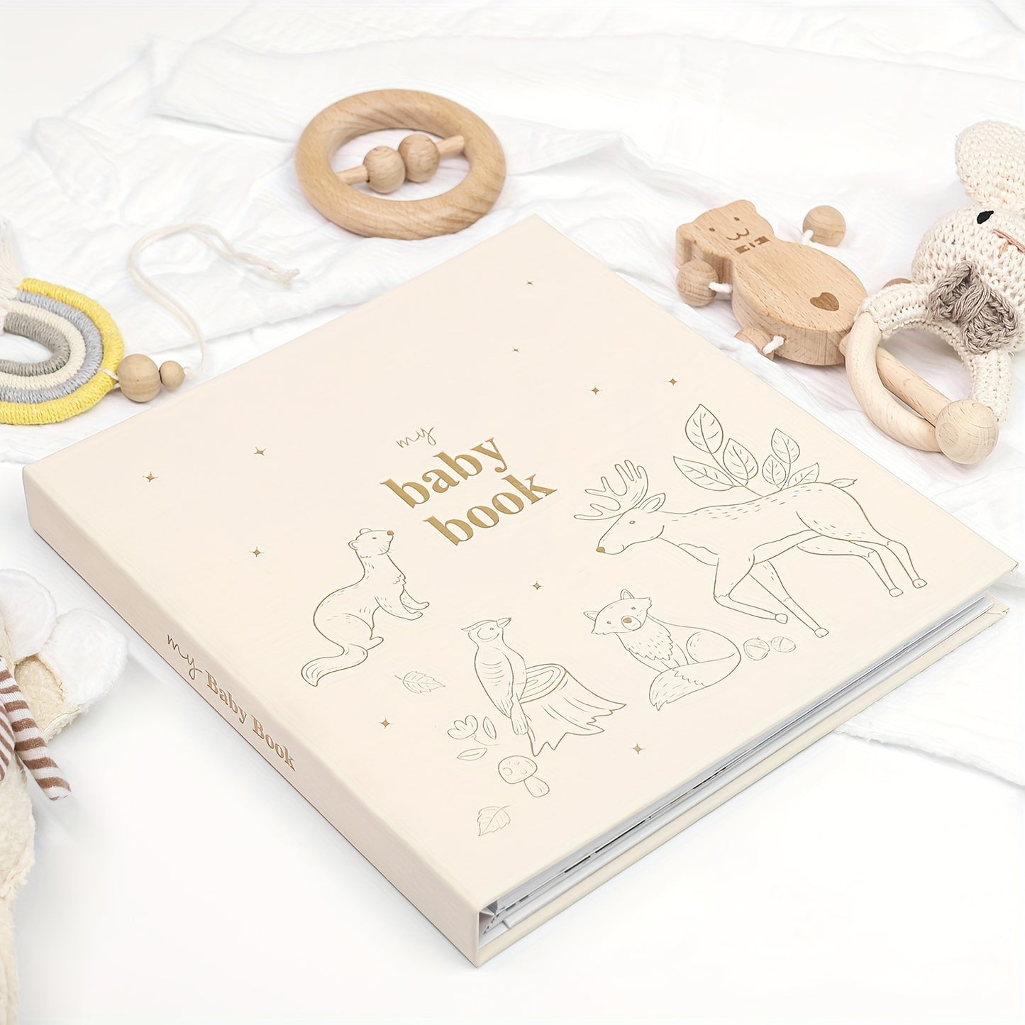 Youngsters commemorative book with hot stamping logo, hidden coil binding, 140gsm weight, double adhesive paper, Linum animal theme. Includes 4 special paper pockets and 12 months milestone.