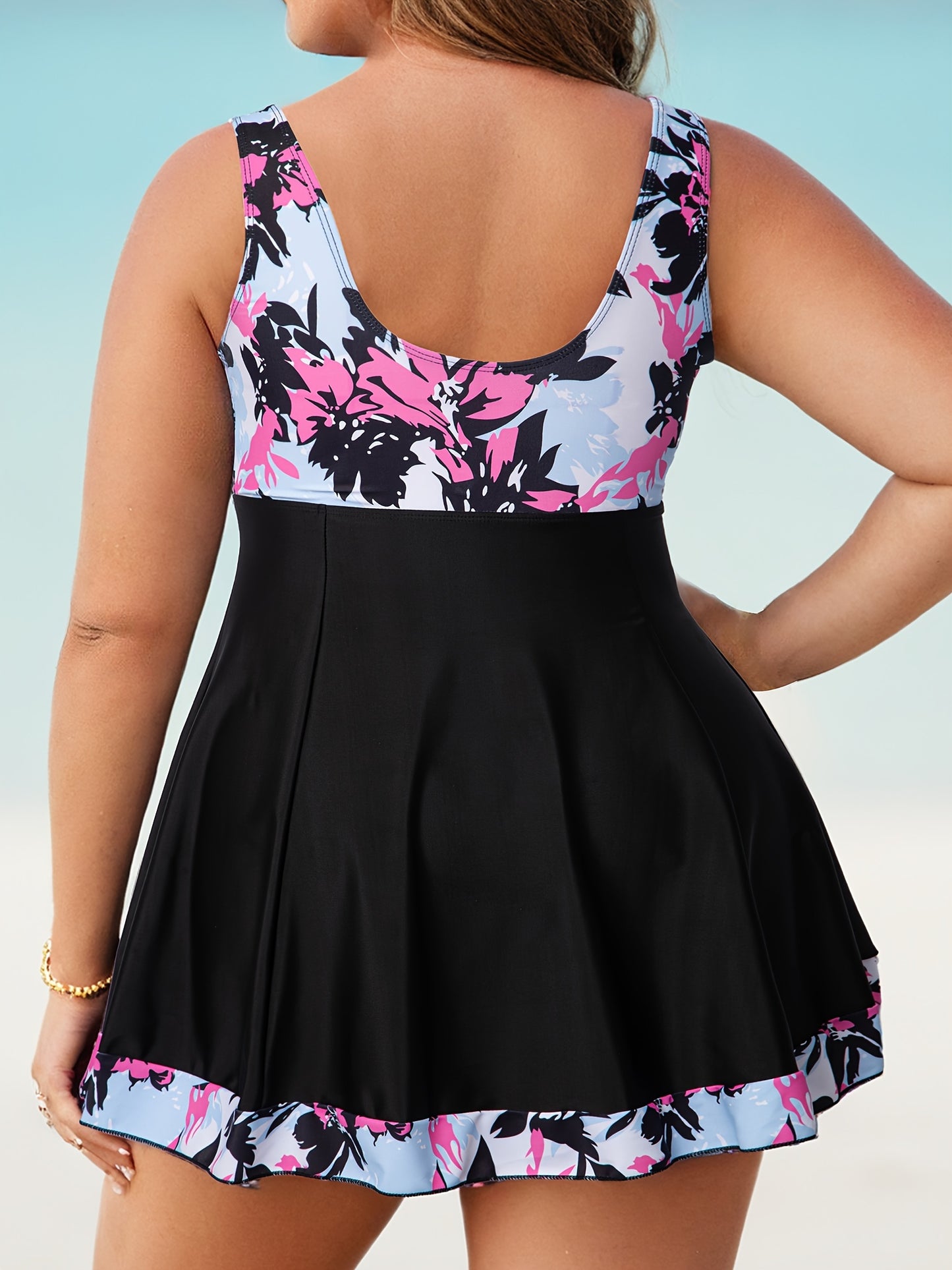 Plus size tankini swimsuit with off-shoulder push-up top, tie front detail, floral print, high-stretch knit fabric, removable chest padding, shorts bottom. Made of 82% polyester and 18%