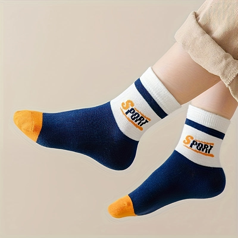 10 pairs of mid-calf length boys athletic tennis socks in blue with orange and white accents. Features a "ONE" design, perfect for all seasons. Hand wash only. Made of polyester blend. Cute