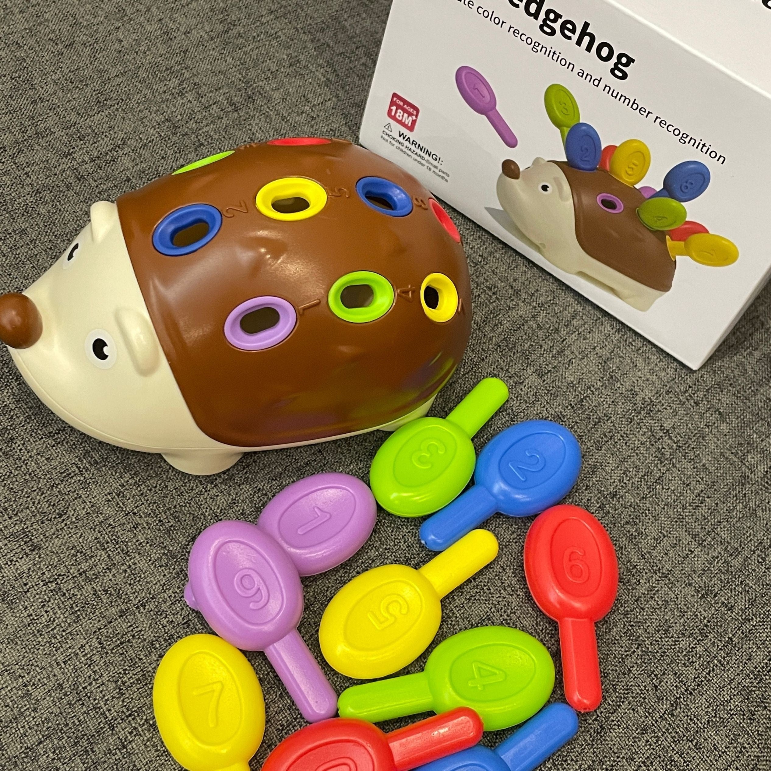 Boost your child's fine motor skills with the Hedgehog Toy! This engaging toy improves hand-eye coordination, problem-solving, and critical thinking. It also teaches colors and numbers, making it the perfect gift for youngsters, preschoolers, boys, and