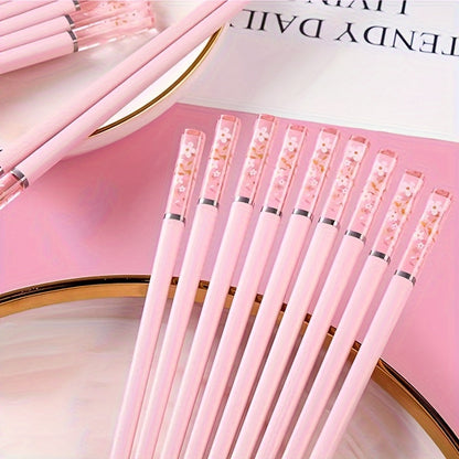 One set of Pink Cherry Flower Amber Chopsticks, ideal for Chinese and Korean style meals such as fast food, sushi, and ramen. Perfect for family meals and reusable kitchen supplies.