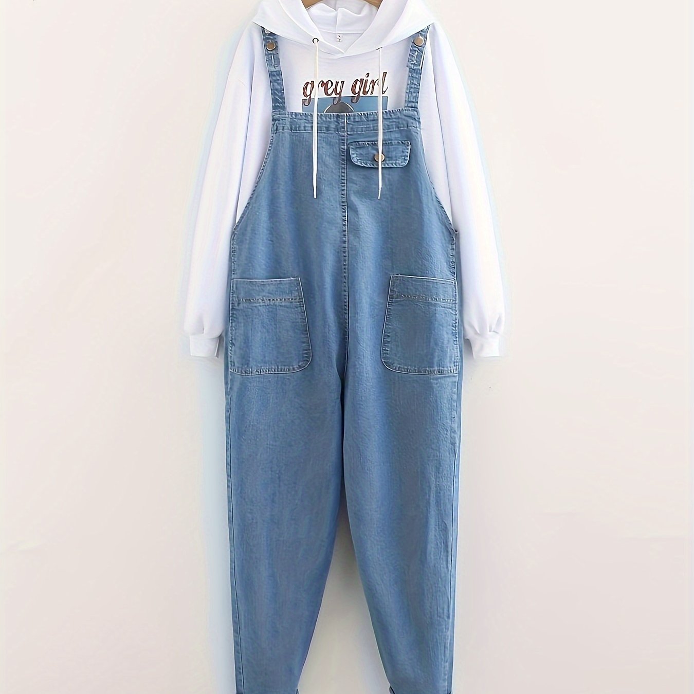 Women's casual style denim overalls in light washed blue, loose fit, also available in denim jeans & clothing.