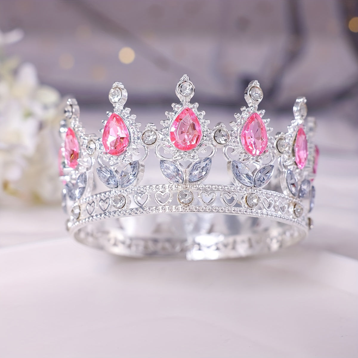 This stunning Baroque style bridal tiara features intricate golden water diamond embellishments, making it ideal for beauty pageants, proms, and formal events. Adorned with delicate flowers in a beautiful full circle design, this tiara is perfect for