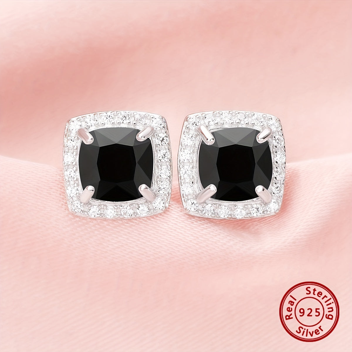 Set of elegant jewelry comprising of three pieces - two earrings and one ring, made of 925 sterling silver and inlaid with black zircon. This set symbolizes romance and mystery, making it perfect for parties and special occasions. The total weight of