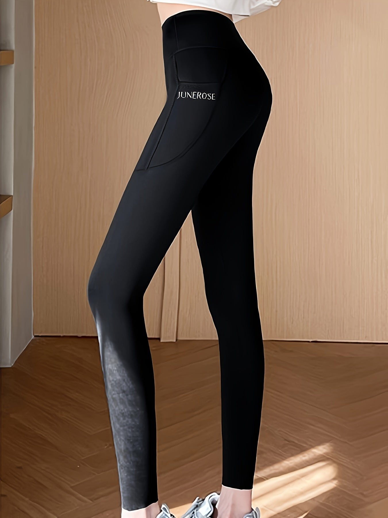 High waist compression pants with tummy control and pockets for women.